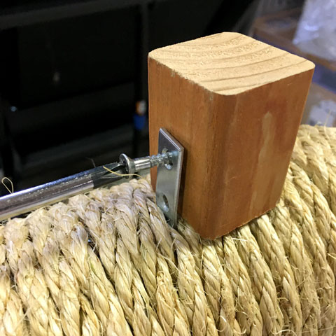 Attaching a wood block to brace a cat tower