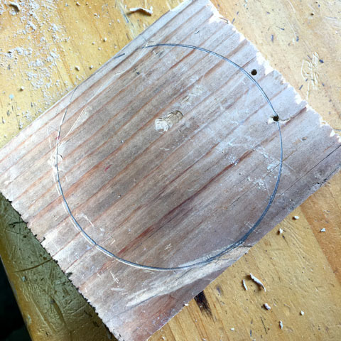 A circle traced on a piece of wood
